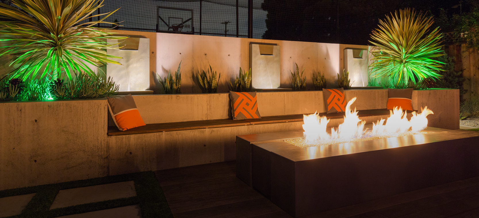 Landscape Lighting design with up-lights, aquatic lights and a fire-pit in Naples, Florida.