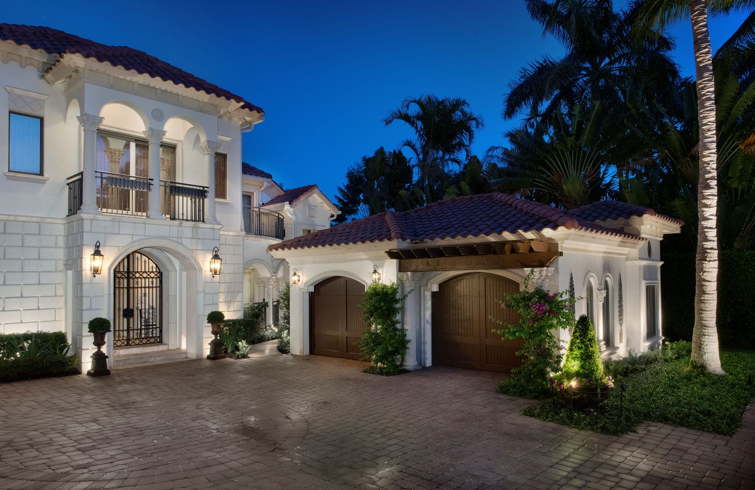 Outdoor lighting project in Port Royal community in Naples, Florida. Estate is well illuminated with architectural and landscape lighting.