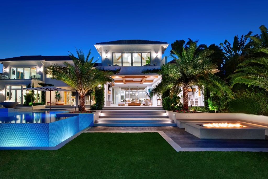 Outdoor lighting project in the Port Royal community in Naples, Florida. This home is well illuminated with landscape lighting, pool lighting and path-lighting.